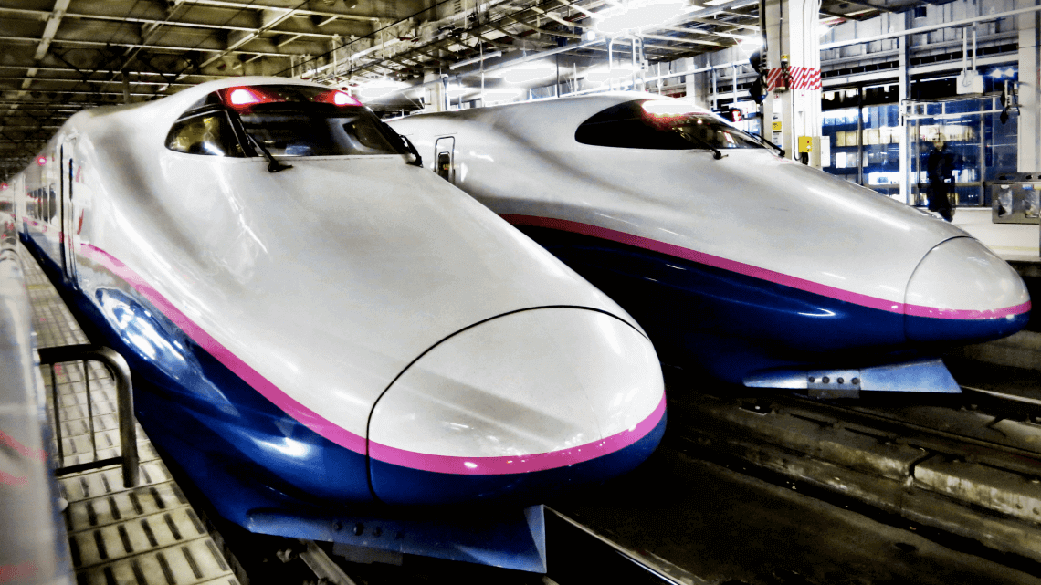 Two shinkansen (bullet trains) await their departure at Tokyo Station, Japan Two shinkansen (bullet trains) await their departure at Tokyo Station, Japan