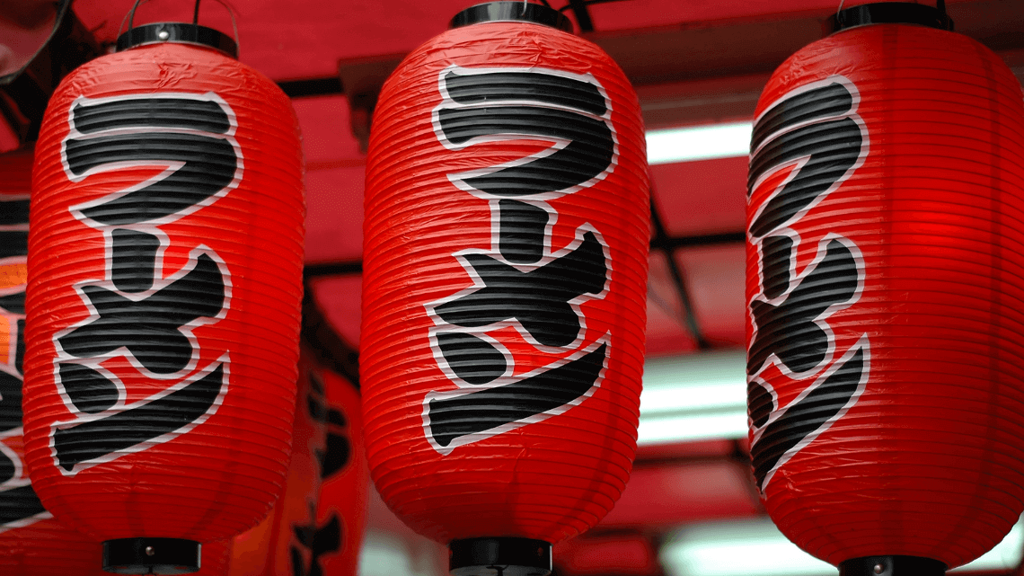 Japanese lanterns hanging outside a ramen shop