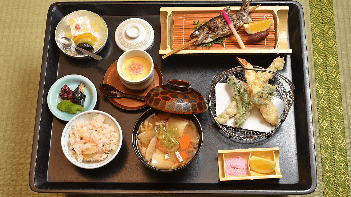 A Japanese multi-course dinner served at a traditional ryokan A Japanese multi-course dinner served at a traditional ryokan
