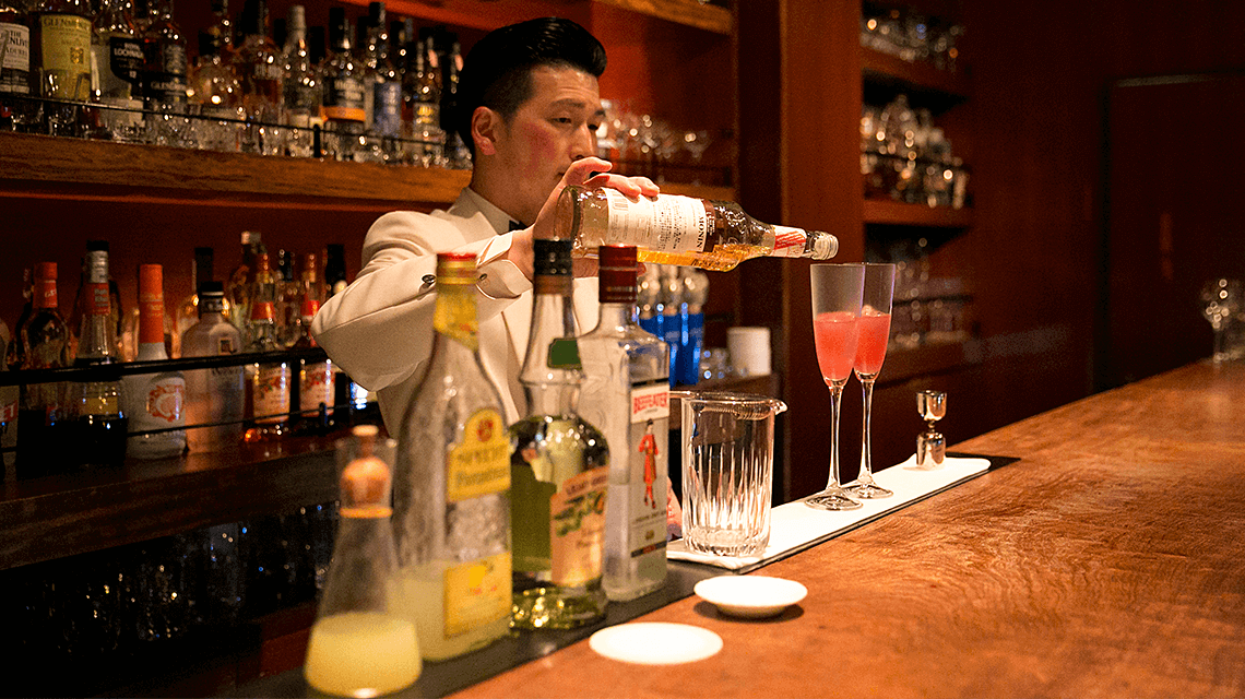 A bartender prepares a cocktail at Bar Oscar, Fukuoka, Japan A bartender prepares a cocktail at Bar Oscar, Fukuoka, Japan