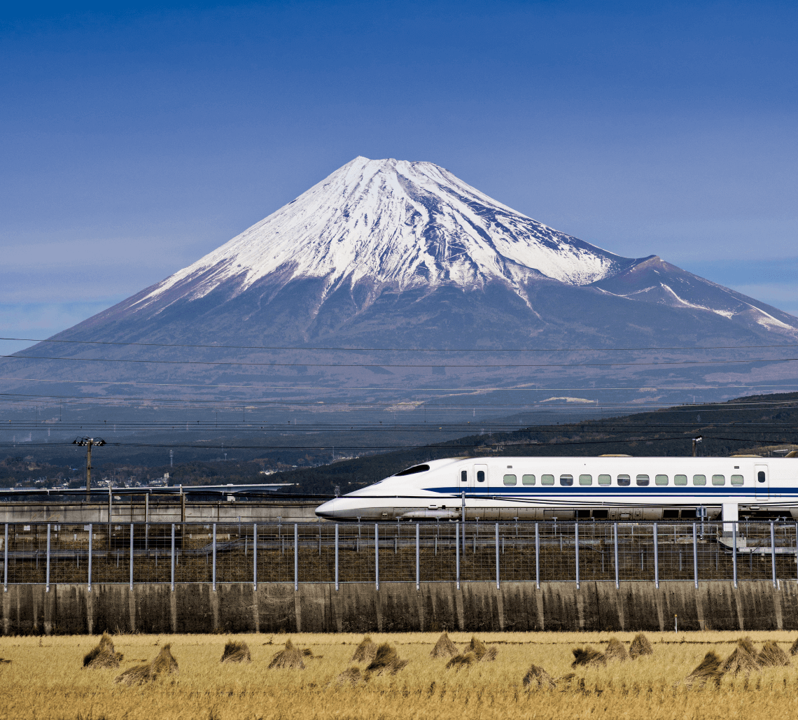 Shinkansen (bullet train) passing Mount Fuji, Japan