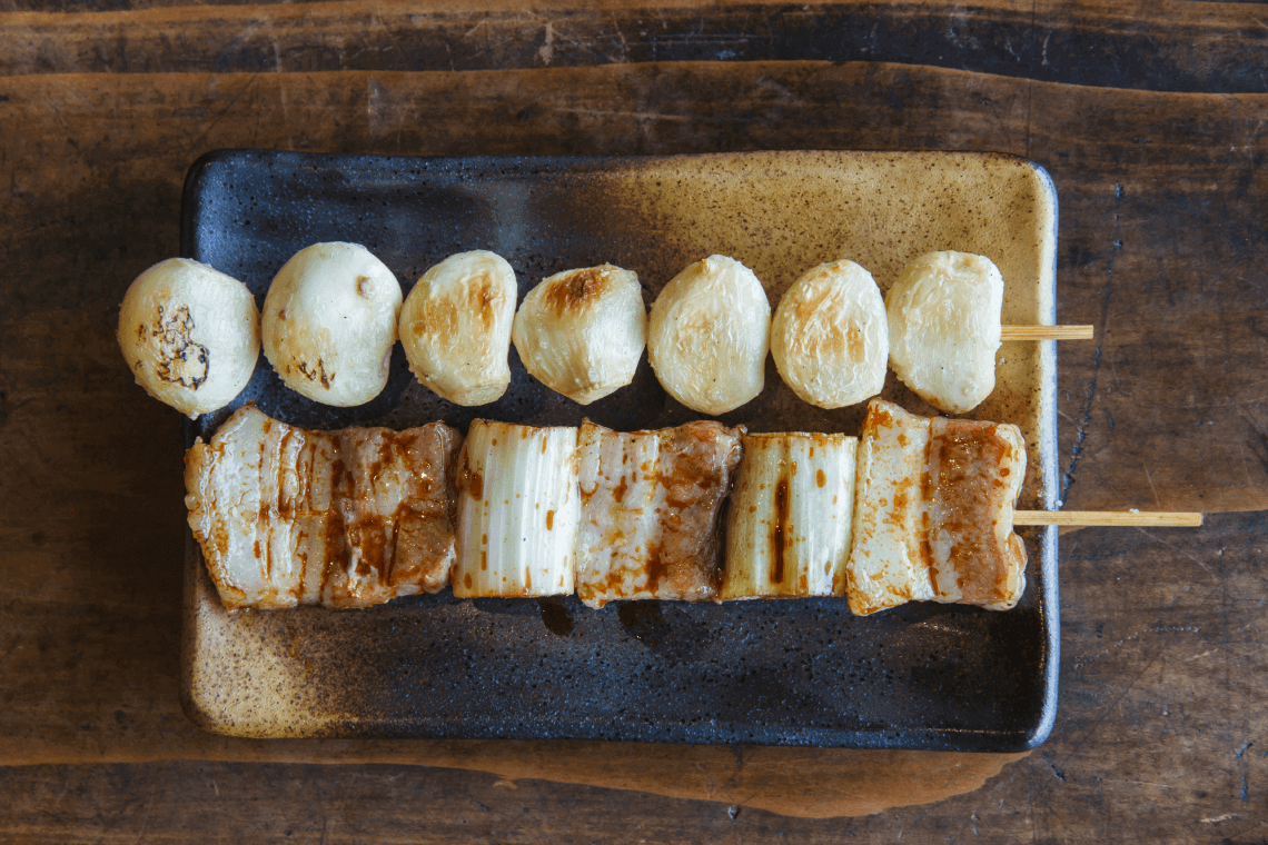 Grilled skewers of yakitori, a popular Japanese food, with chicken and garlic