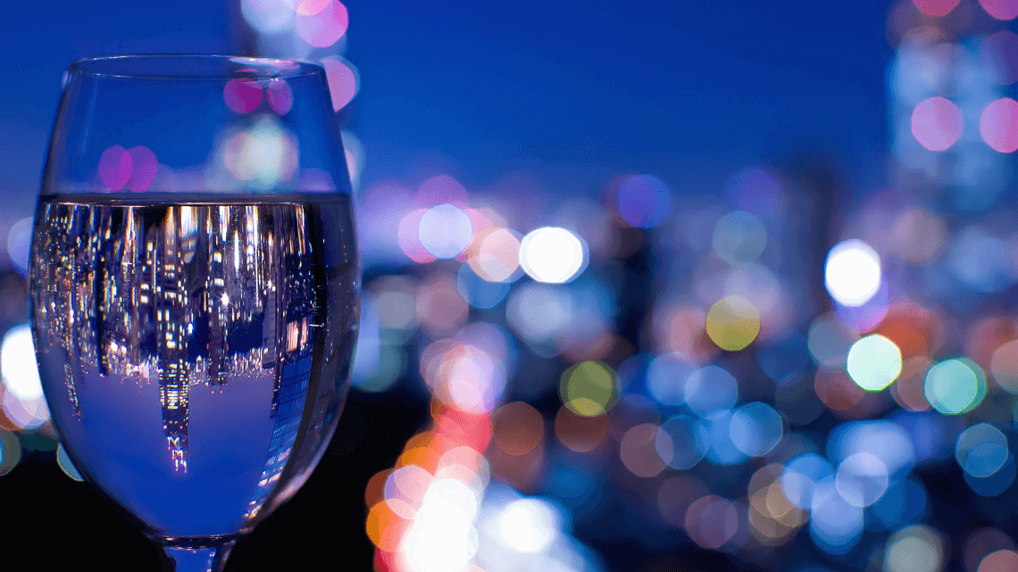 A reflection of the Tokyo skyline in a wine glass