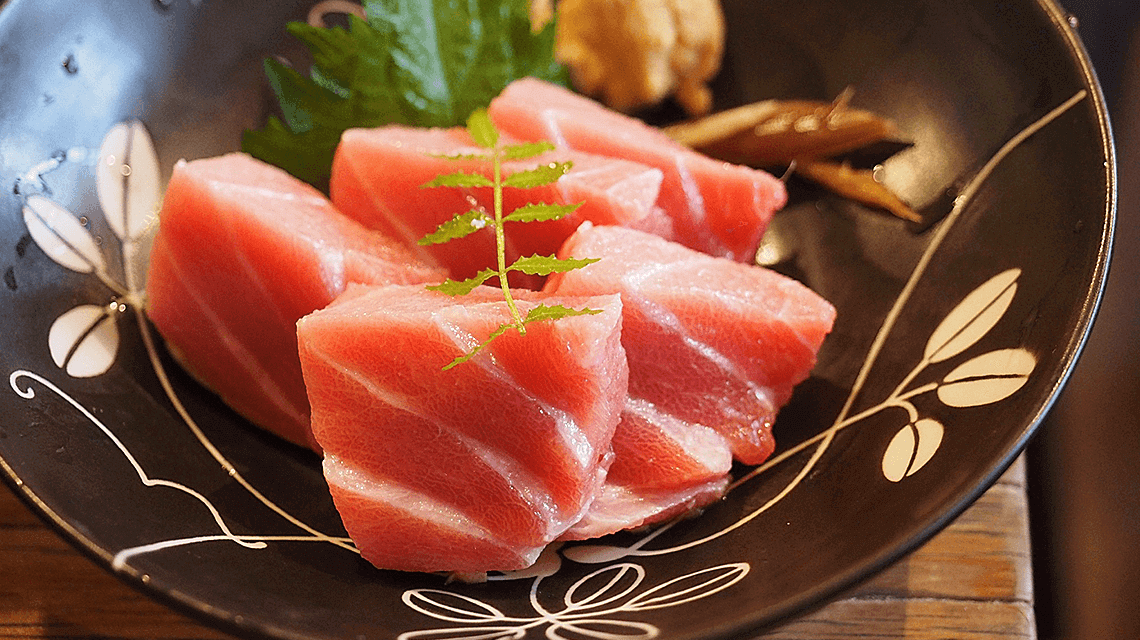 Tuna sashimi served at a sushi restaurant in Tokyo, Japan Tuna sashimi served at a sushi restaurant in Tokyo, Japan