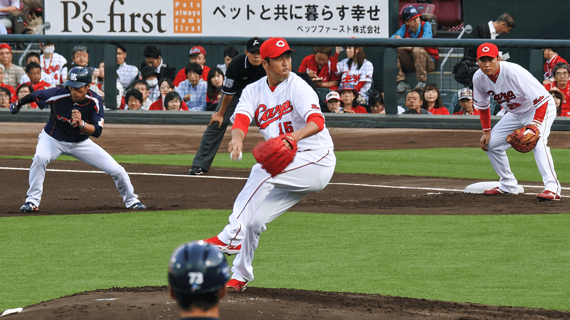 Baseball player Hiroki Kuroda pitching at Mazda Zoom Zoom Stadium, Hiroshima, Japan